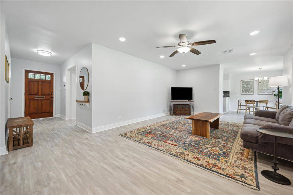 From the entry into the spacious den which flows to the breakfast room.