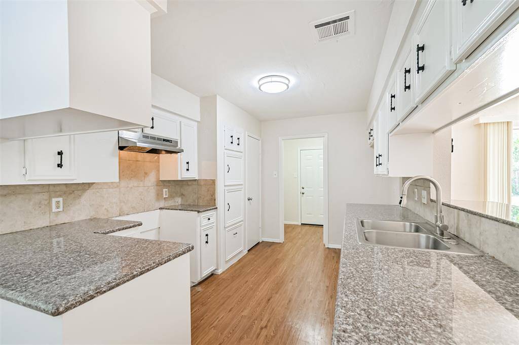 Granite countertop and bar serving/seating area