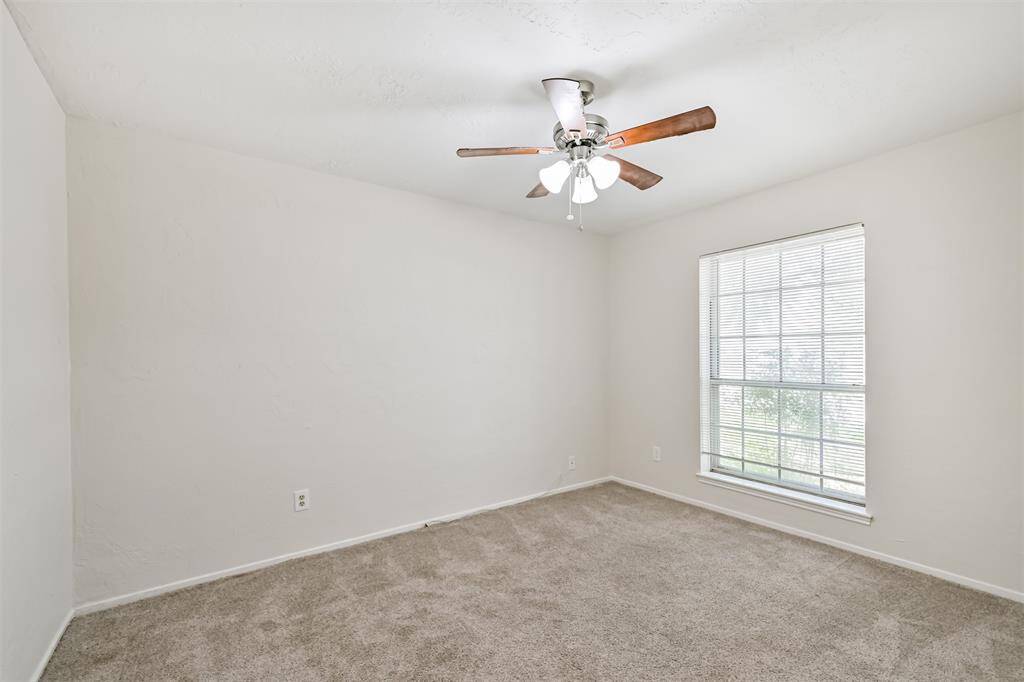 Bed 3 with carpet and ceiling fan