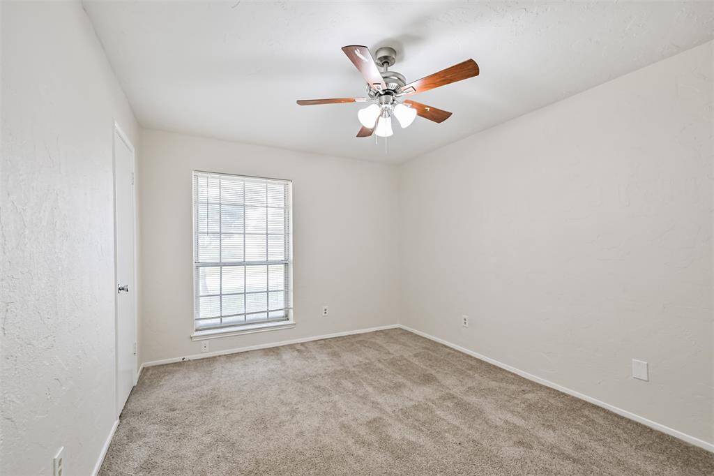 Bedroom 4 with carpet and ceiling fan