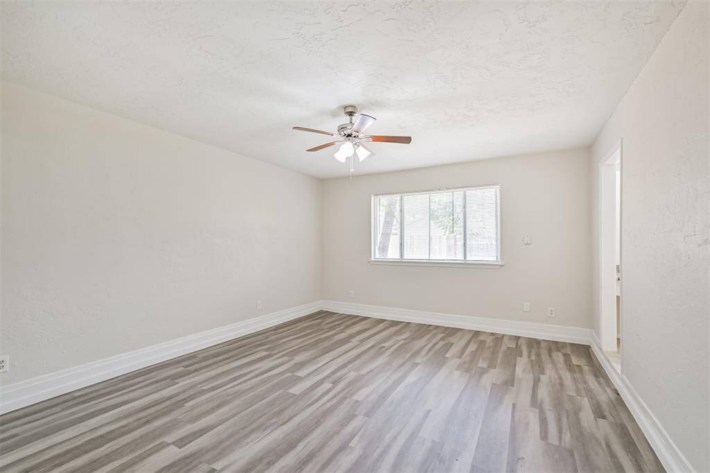 Spacious Primary bedroom with vinyl plank flooring and en suite bath!