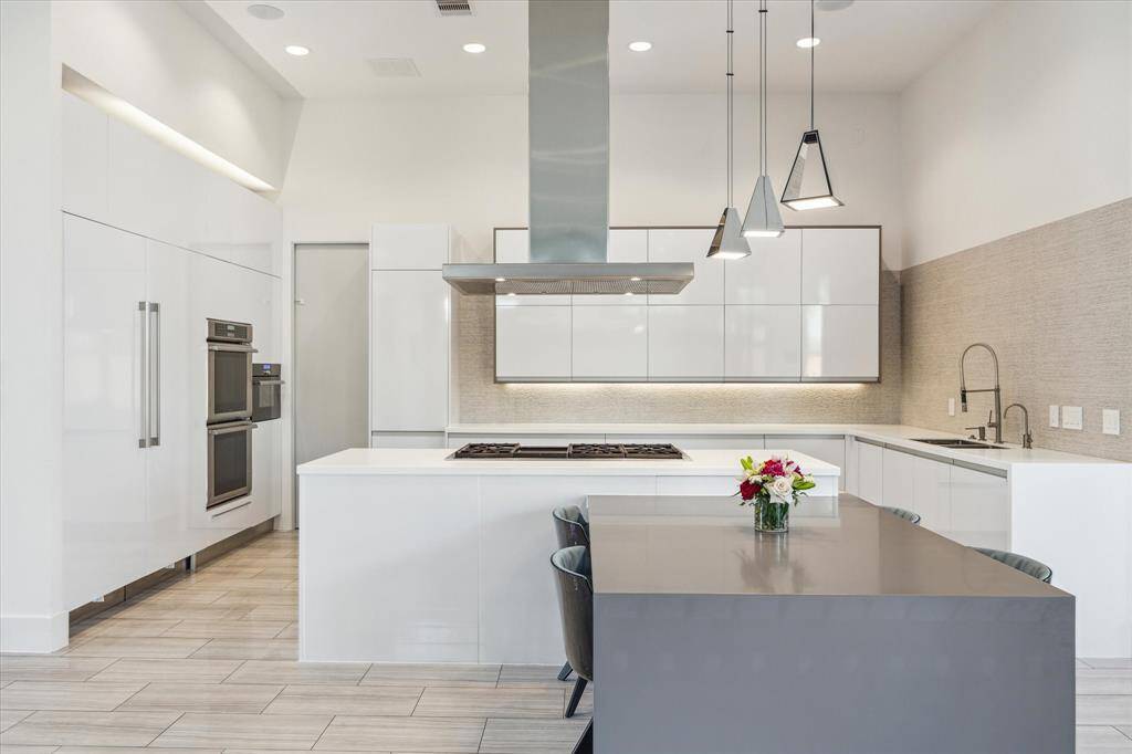 At the heart of the home is a PORCELANOSA-designed kitchen, blending modern elegance and functionality.