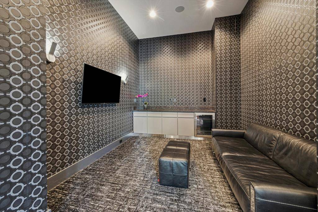 Just off the primary suite is this sitting lounge area, perfect for morning coffee, evening wind-downs, or watching your favorite shows.