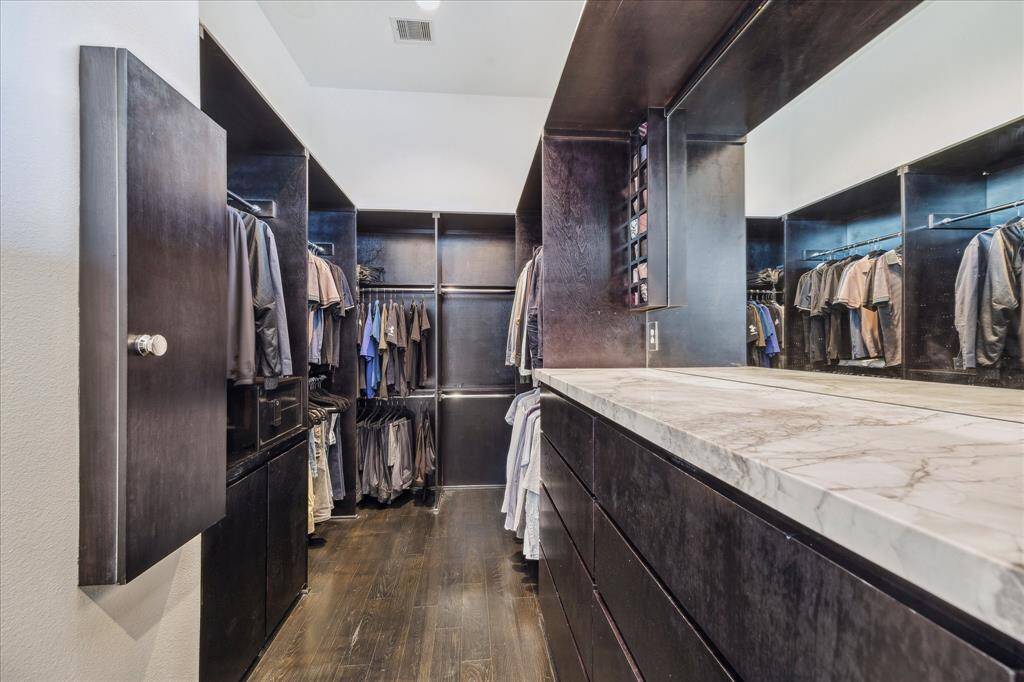 There's two walk-in closets with custom built-ins.