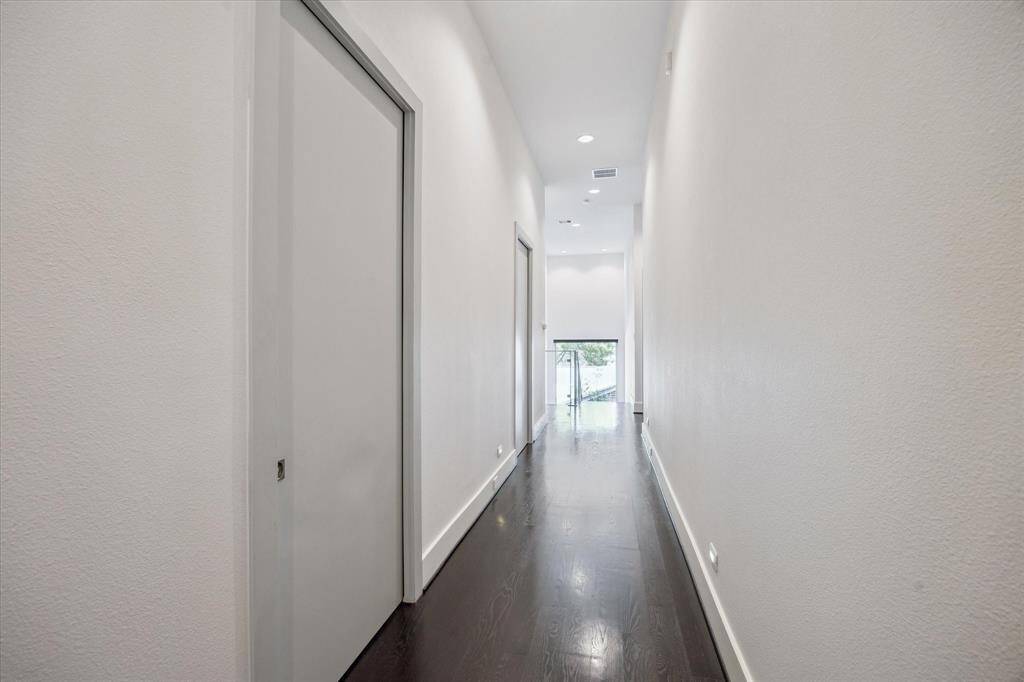 Second floor hallway with an abundance of natural light.