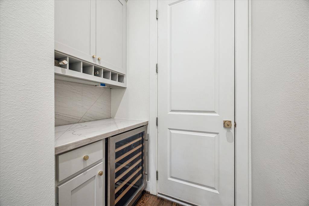 As you walk in the garage, there is ample counter space as well as a dry bar convenient to the kitchen area.
