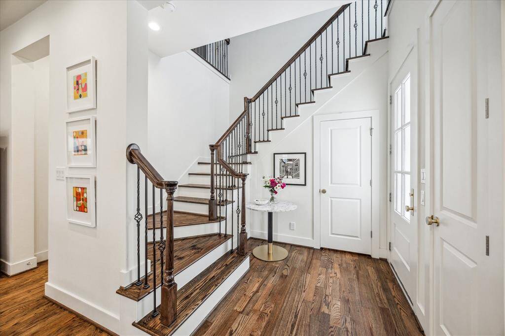 The beautiful entryway provides quick access to the winding stairway or directly into the dining and kitchen area.