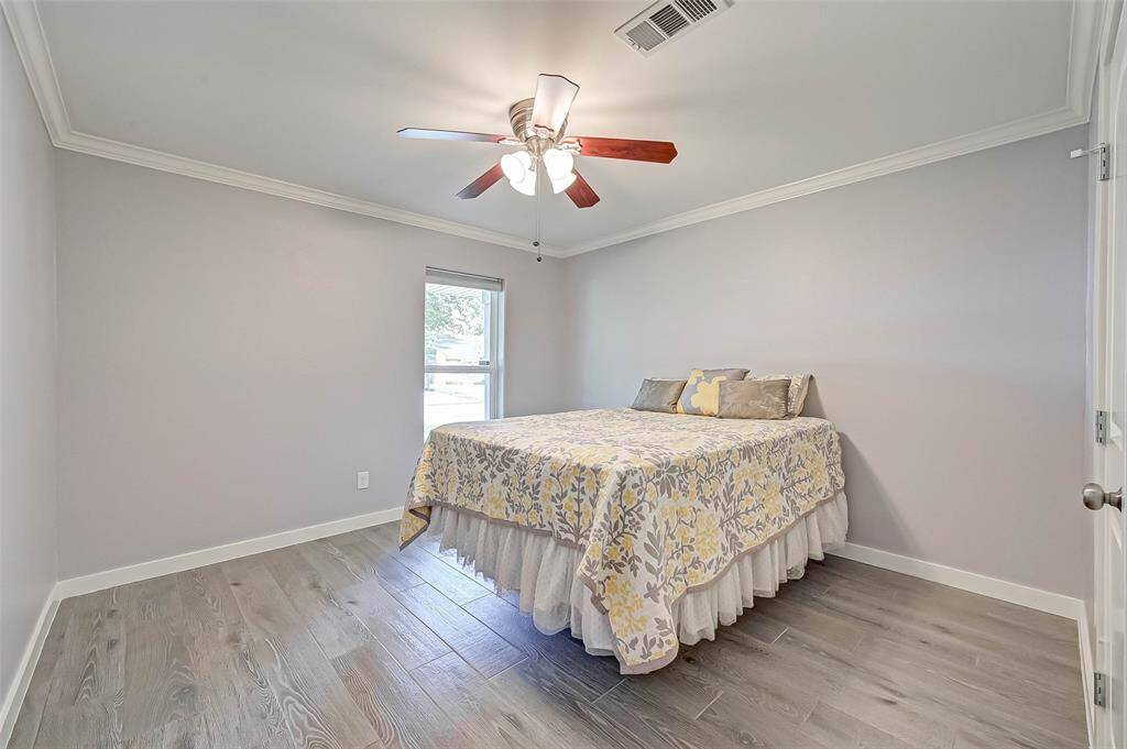 This immaculate home features 3 bedrooms. This bedroom is located by the facing the front of the home and is perfect for a bedroom, an office, or a guestroom!
