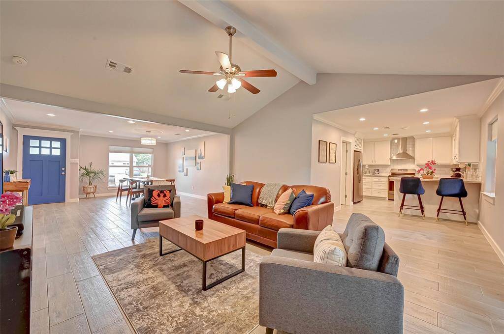 This living  room conveniently connects to the dining room, breakfast area and Kitchen for easy entertaining!