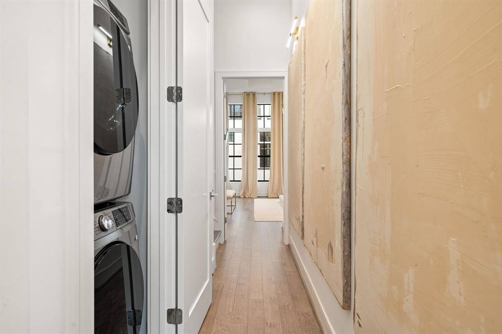 Custom art work, STAYS! Stacked washer and dryer unit on the second floor.