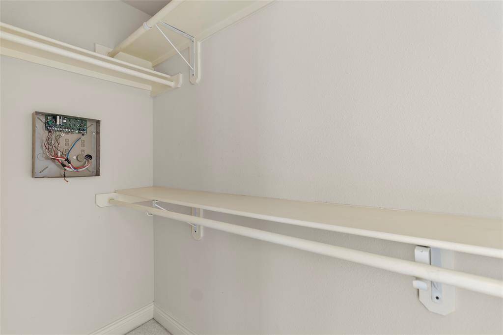 Built-in shelving and dual hanging rods give your closet plenty of room to organize clothes, accessories, and seasonal items with ease.