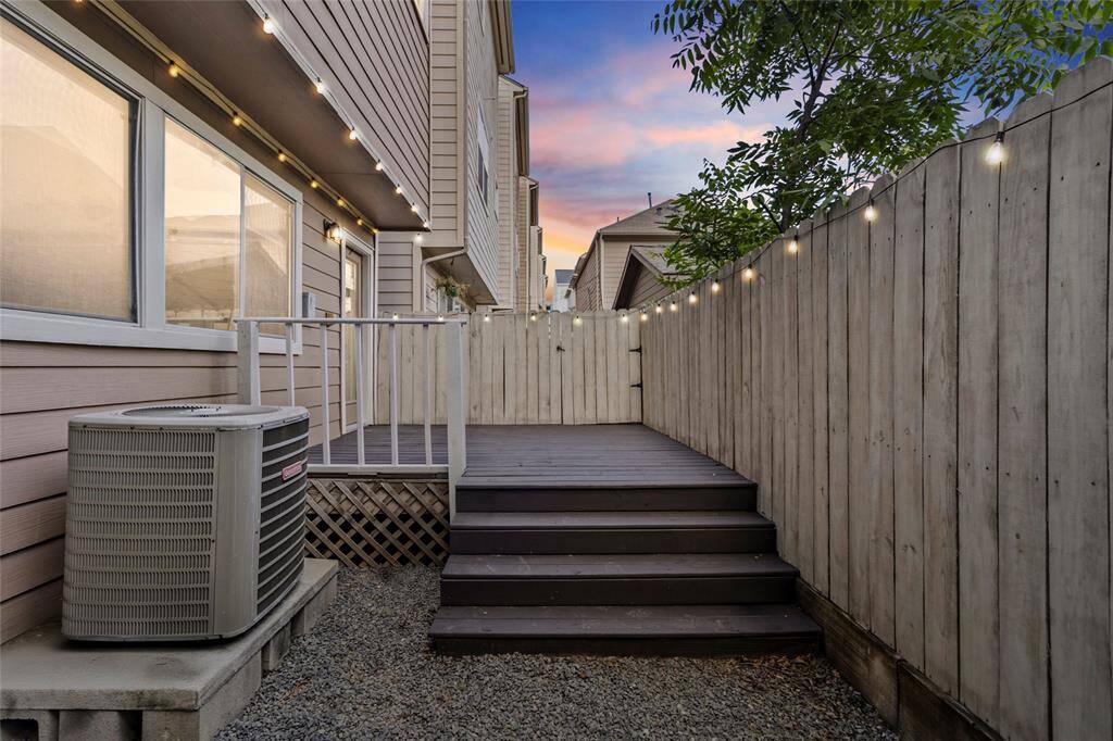 Your private backyard retreat makes the most of its space with a raised wood deck—ideal for casual hangouts, morning coffee, or winding down under string lights. The gravel base keeps maintenance easy, while the fenced perimeter offers both privacy and peace in the heart of the city.