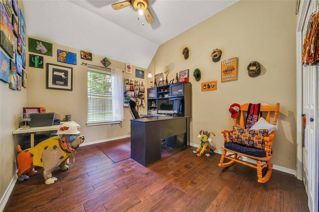 Bedroom 2 offers a updated fan, natural light, ample closet space and is currently  a functional art room!