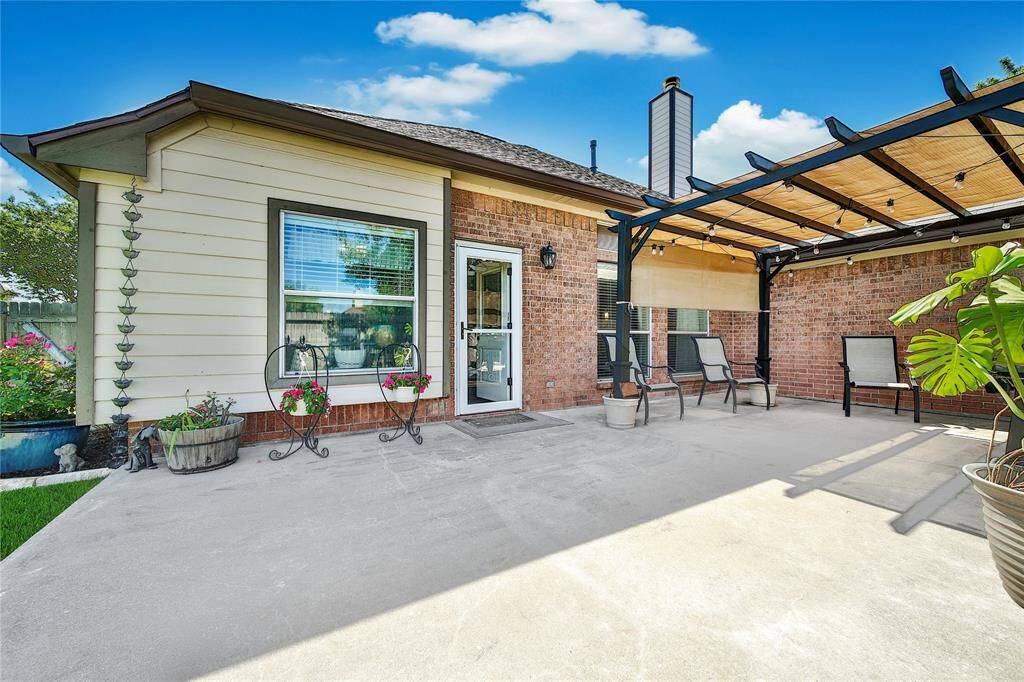 Oversized back patio with pergola.  Excellent space for coffee and winding down in the evenings!