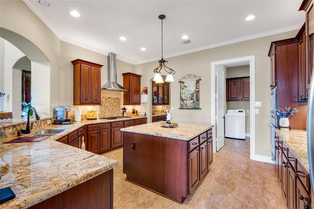 Spacious kitchen provides plenty of room for entertaining family and guest.  A nearby laundry area adds convenience.