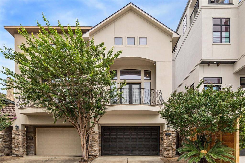 Beautiful 3-story townhome with attached garage and private driveway for additional parking.