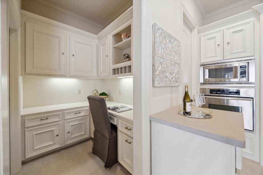 This flex space (adjacent to kitchen) can be used as a butler's pantry or office nook.