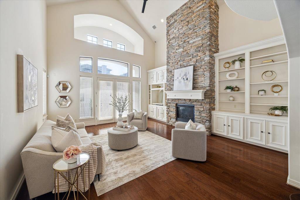 Living room boasts 2-story cathedral ceilings and tons of natural light.