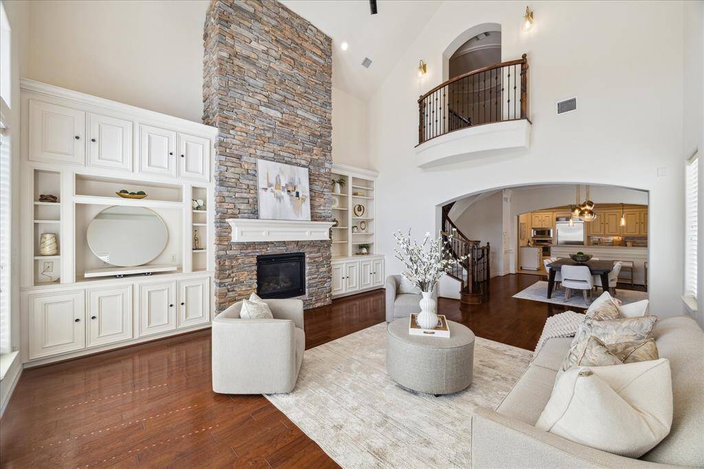 Living room is complete with built-ins and functional gas fireplace.