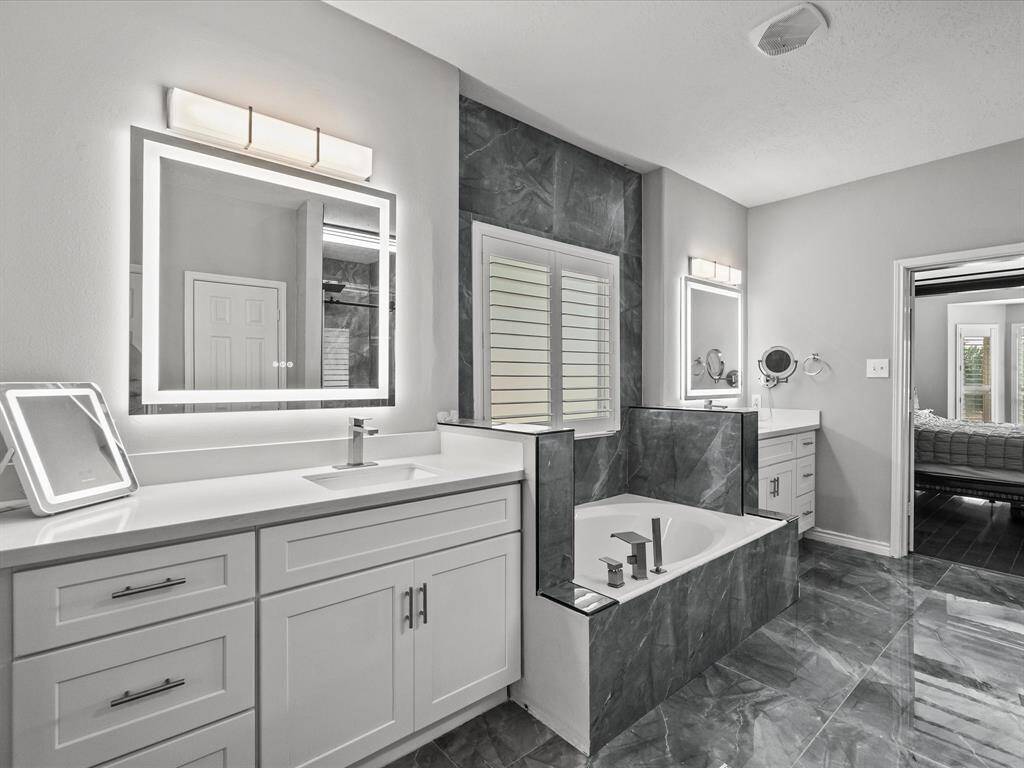 Dual Vanities & Two Walk-In Closets and LED anti fog mirrors