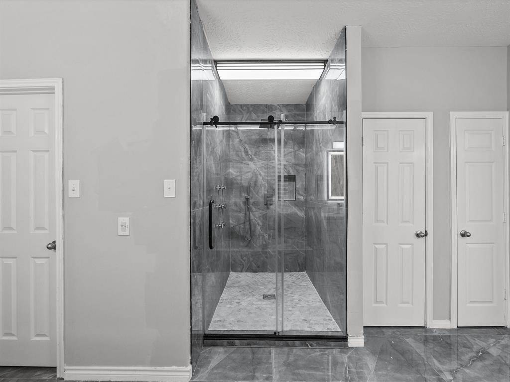Huge walk in shower with multiple spray jets