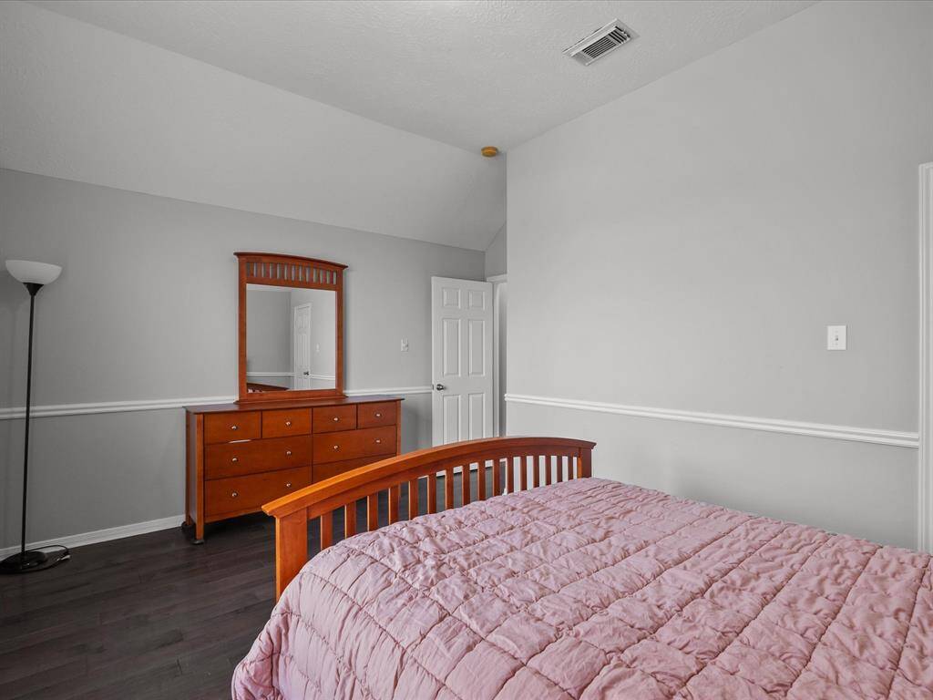First of three secondary upstairs bedrooms.