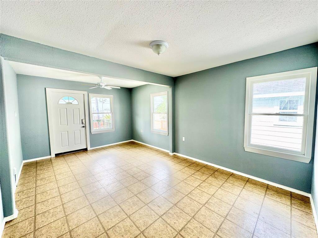 Large Primary Bedroom w/ Access to Porch Looking at Offatt's Bayou