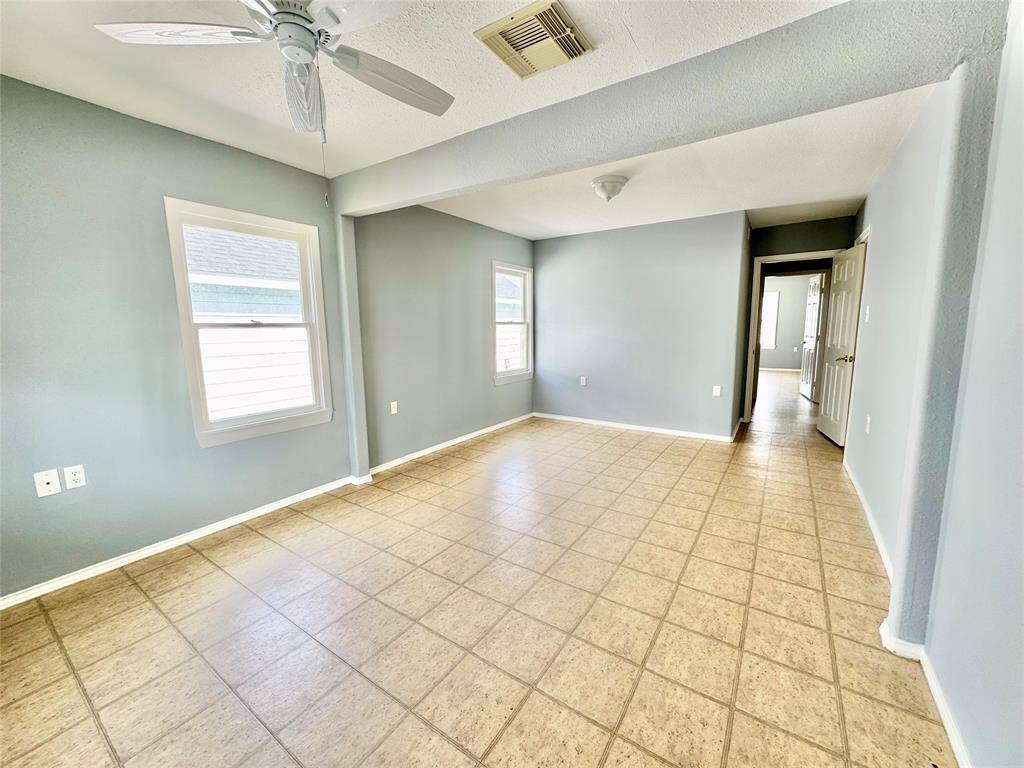 Large Primary Bedroom w/ Access to Porch Looking at Offatt's Bayou