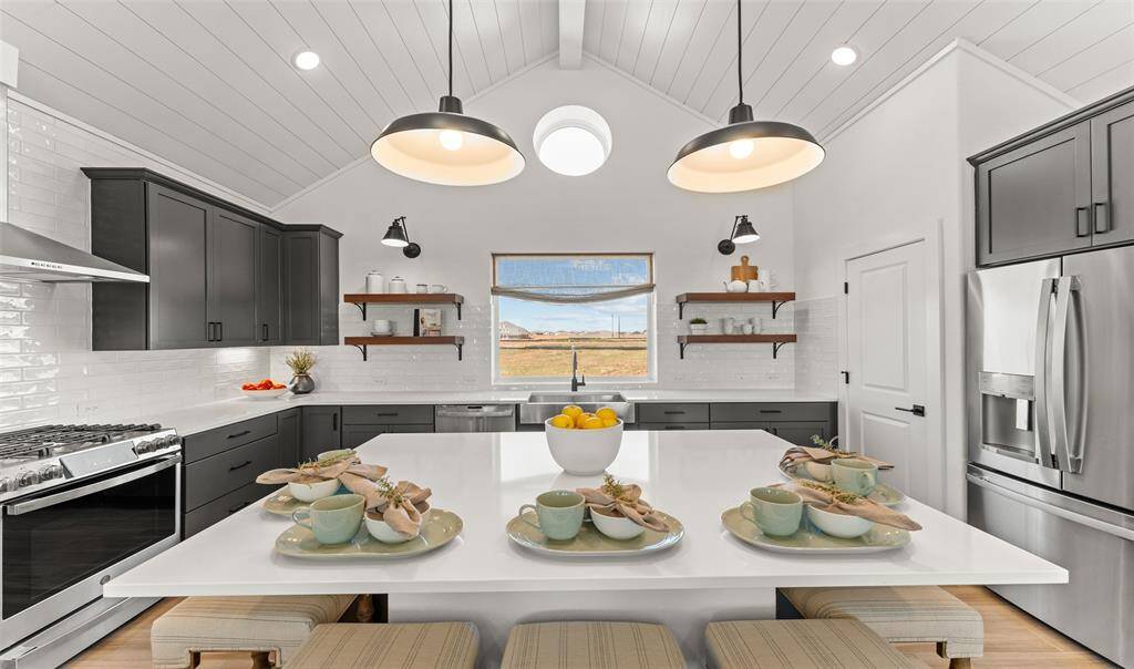 Island kitchen with quartz countertops (*Photo not of actual home and used for illustration purposes only.)