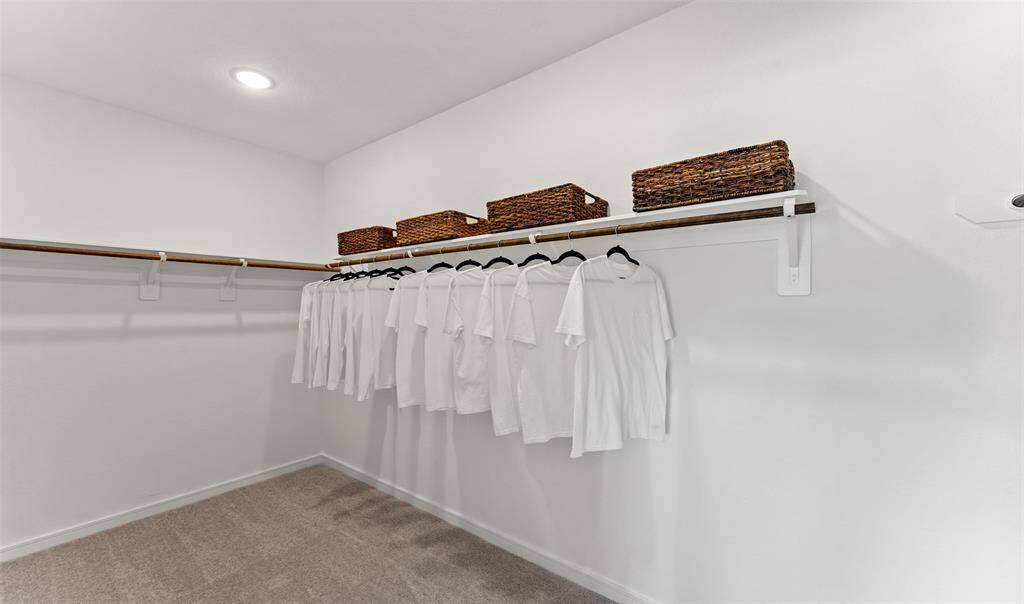 Generous walk-in closet in the primary suite (*Photo not of actual home and used for illustration purposes only.)