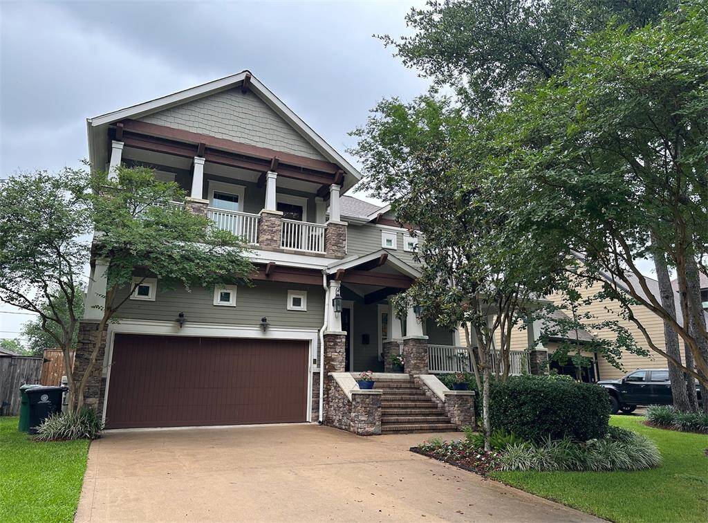 Expansive double-width driveway offers easy access to the oversized garage—ideal for multiple vehicles or added storage.