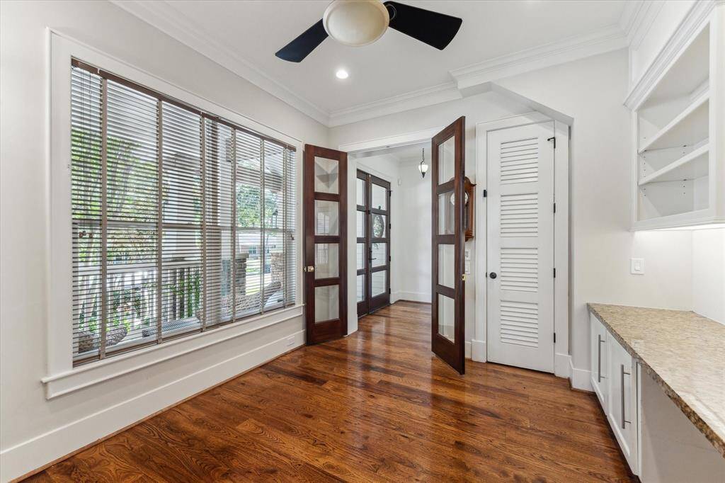 The dining room showcases lovely backyard views and opens gracefully to the kitchen for easy entertaining.