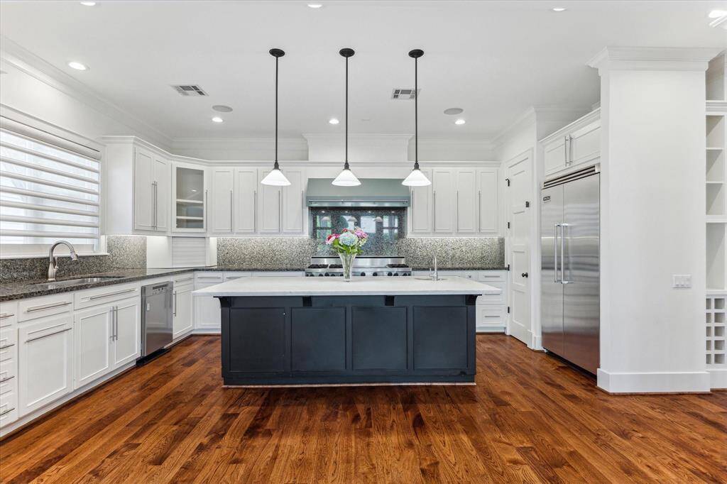 The oversized island offers ample seating—perfect for casual meals or gathering with family and friends