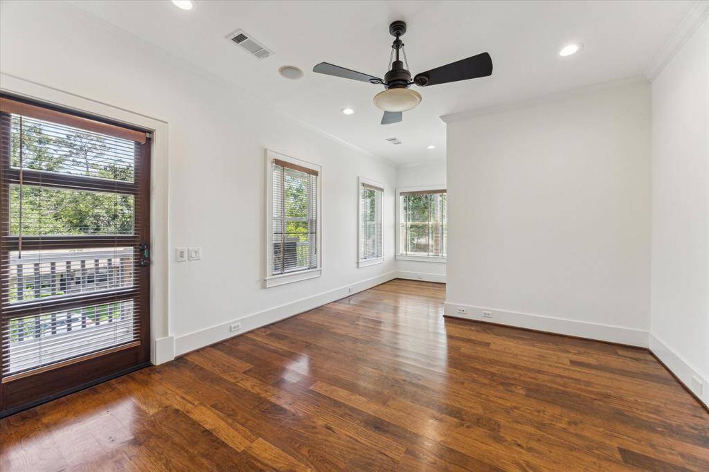 The spacious primary suite is drenched in natural light, offering a peaceful retreat at the end of the day.