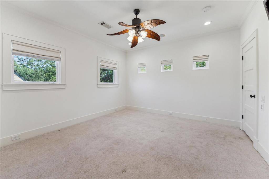 Private ensuite bathroom offers convenience and style for guests or family members.