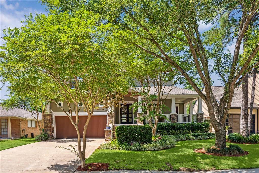 Elegant steps lead to a charming front porch and stunning front door—an inviting welcome for guests.