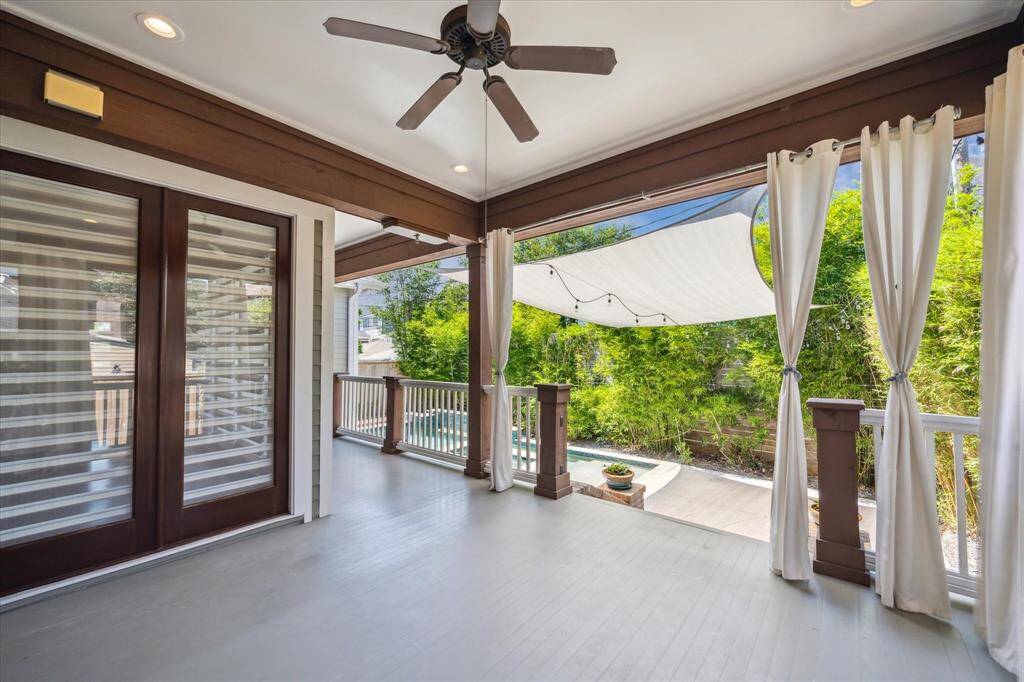 Step down to the beautifully designed pool area and spacious entertaining deck.