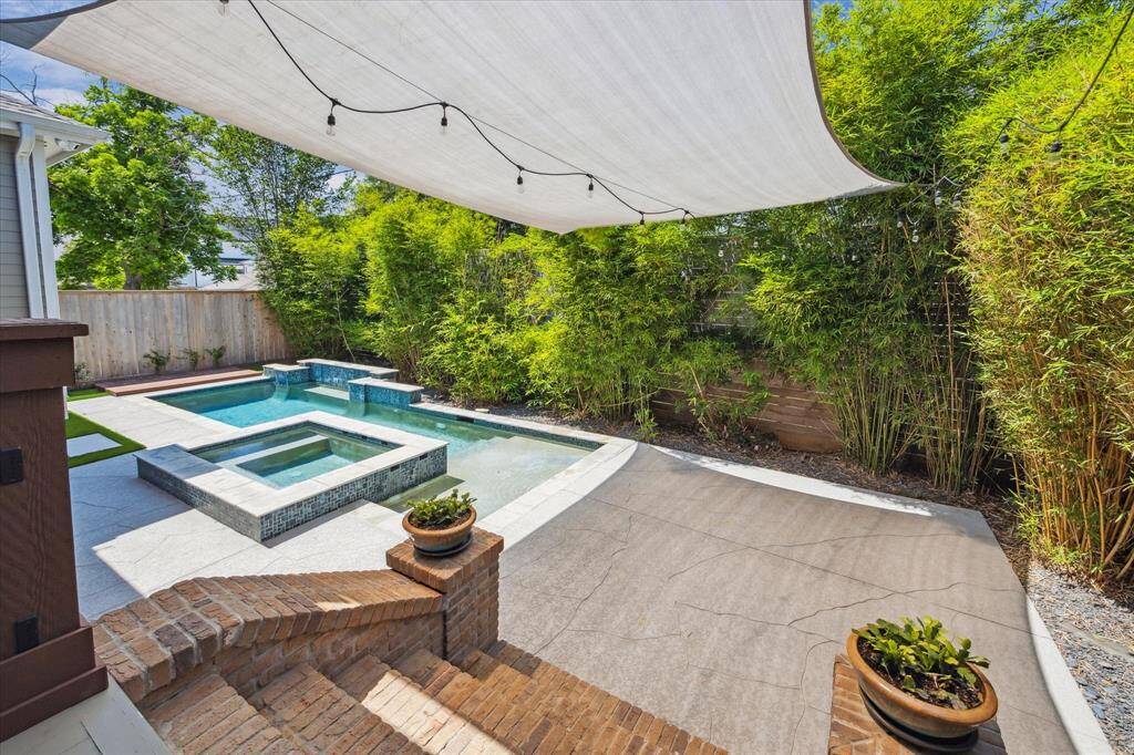 The expansive poolside deck is perfect for lounge chairs, alfresco dining, or a children’s play area.
