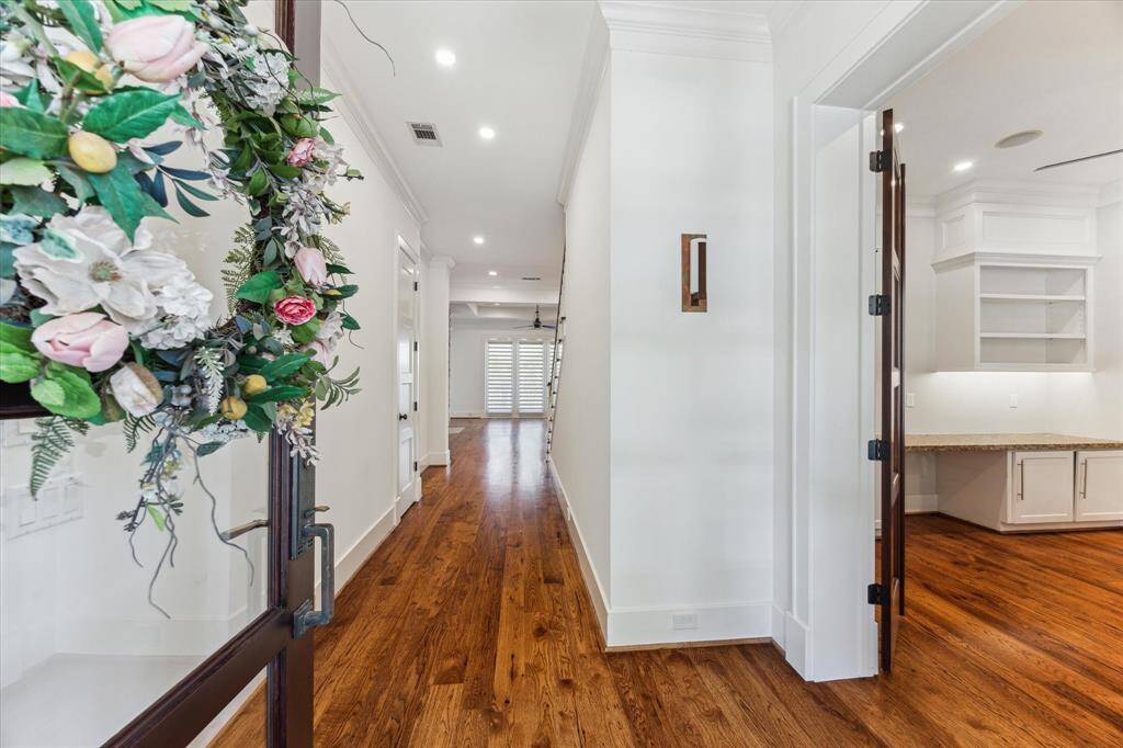 he spacious living room is bathed in natural light, offering warmth and comfort throughout the day.
