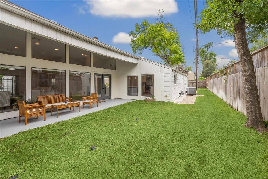Another view of the backyard, highlighting the additional yard space to the south side of the yard.