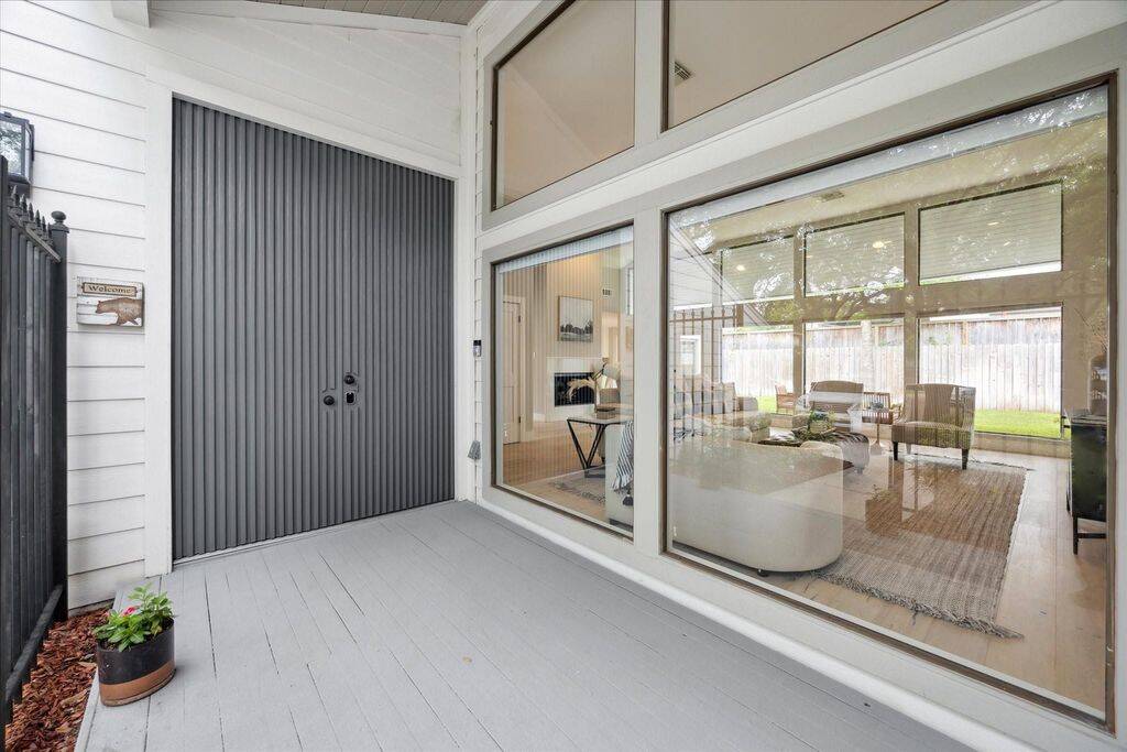 The front porch offers quite the first impression with large windows and a impressive front door entrance.