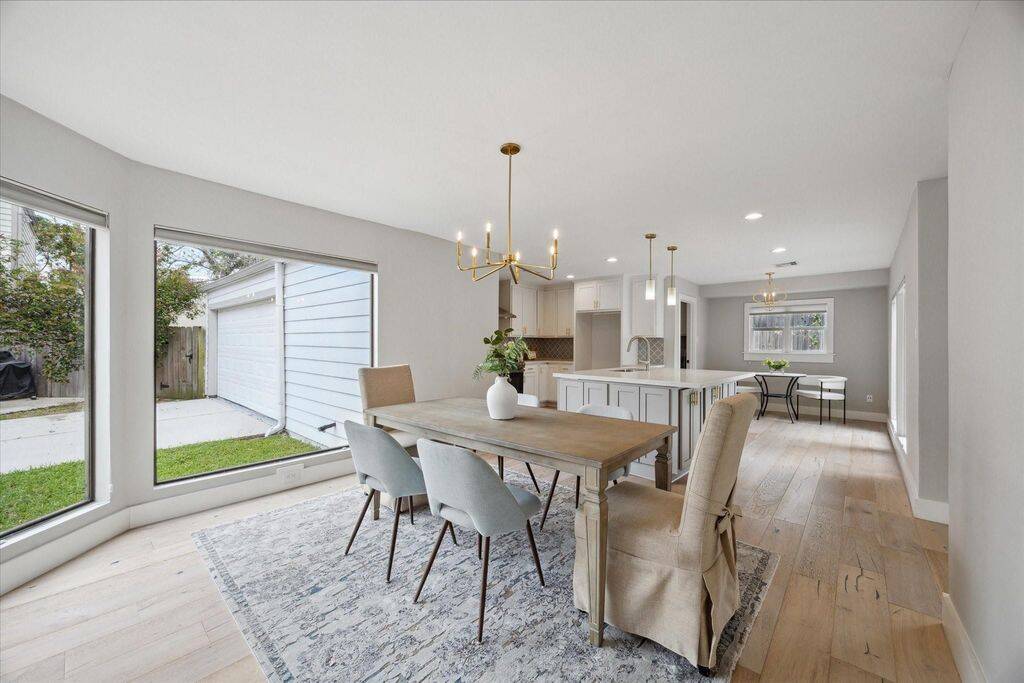 With sunlight streaming in, the dining room effortlessly hosts a six-person table—an inviting space for both casual meals and special occasions.