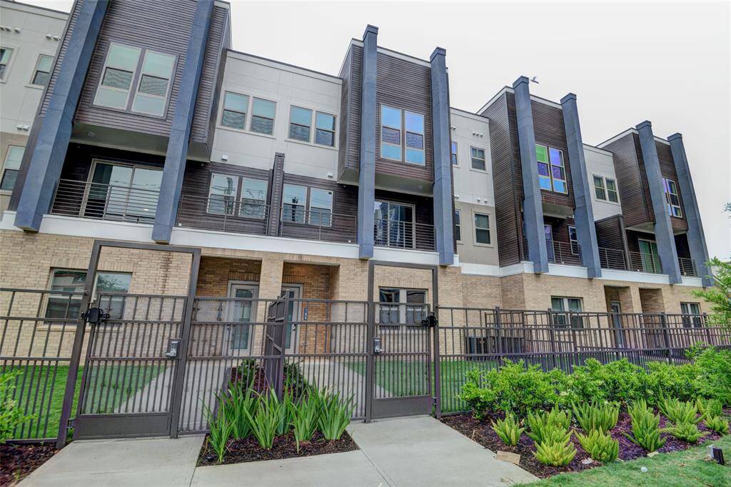 This townhome features a landscaped and gated front yard for added privacy and appeal.