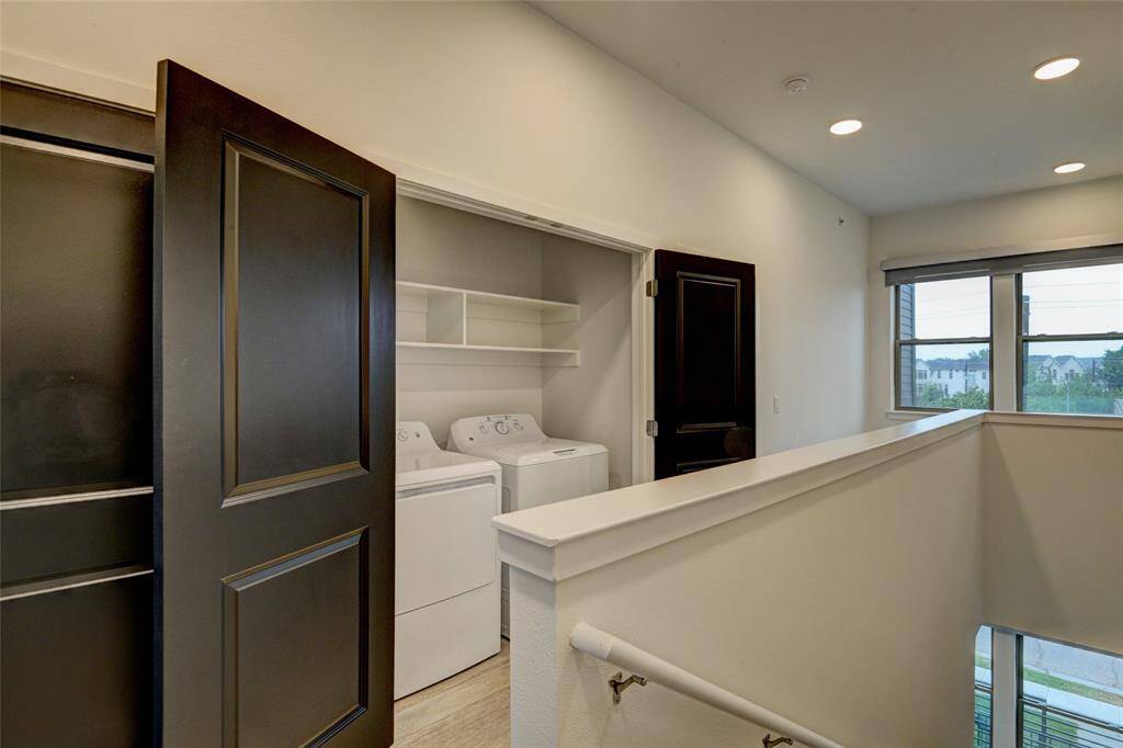 Full-size washer and dryers are located between the bedrooms.