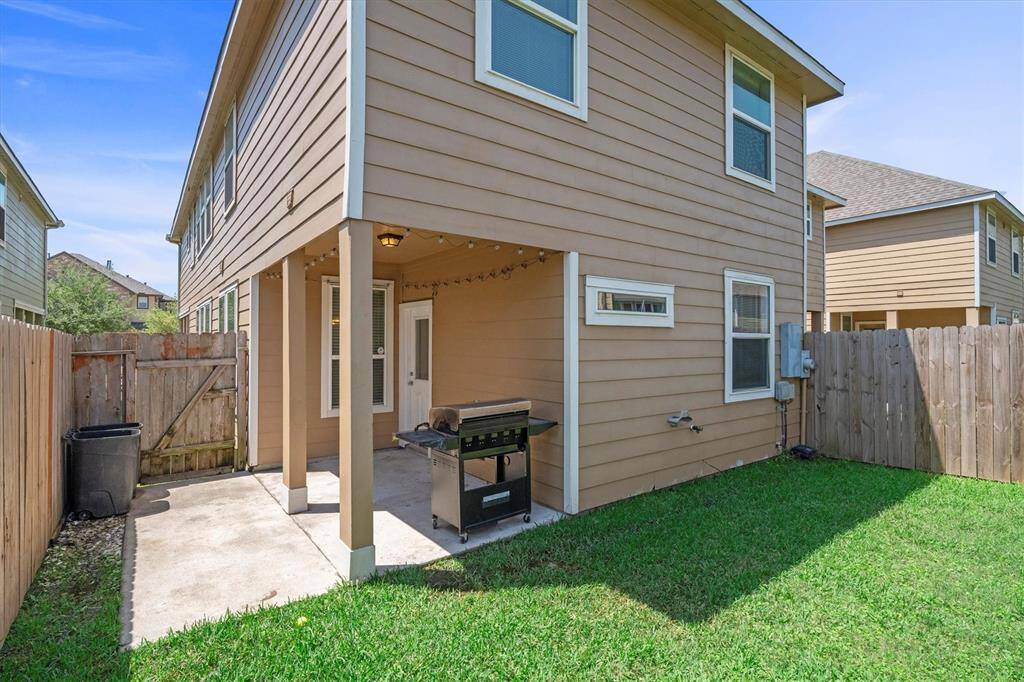 Backyard has a covered patio!