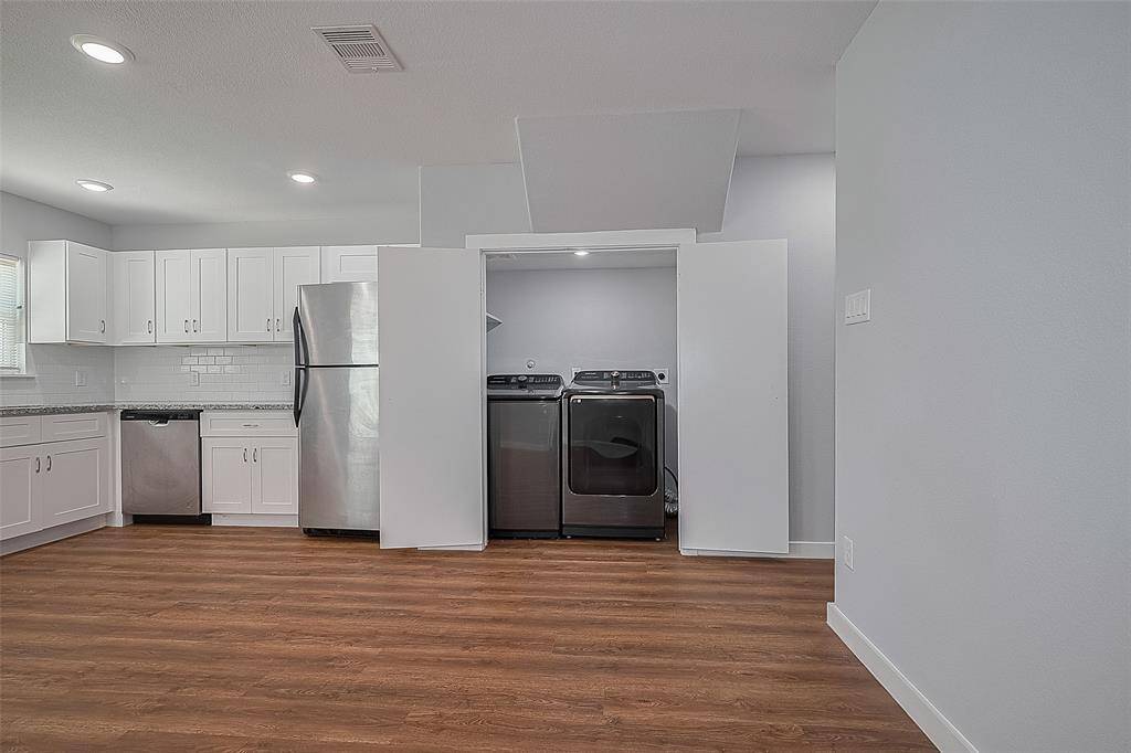 Laundry room next to kitchen