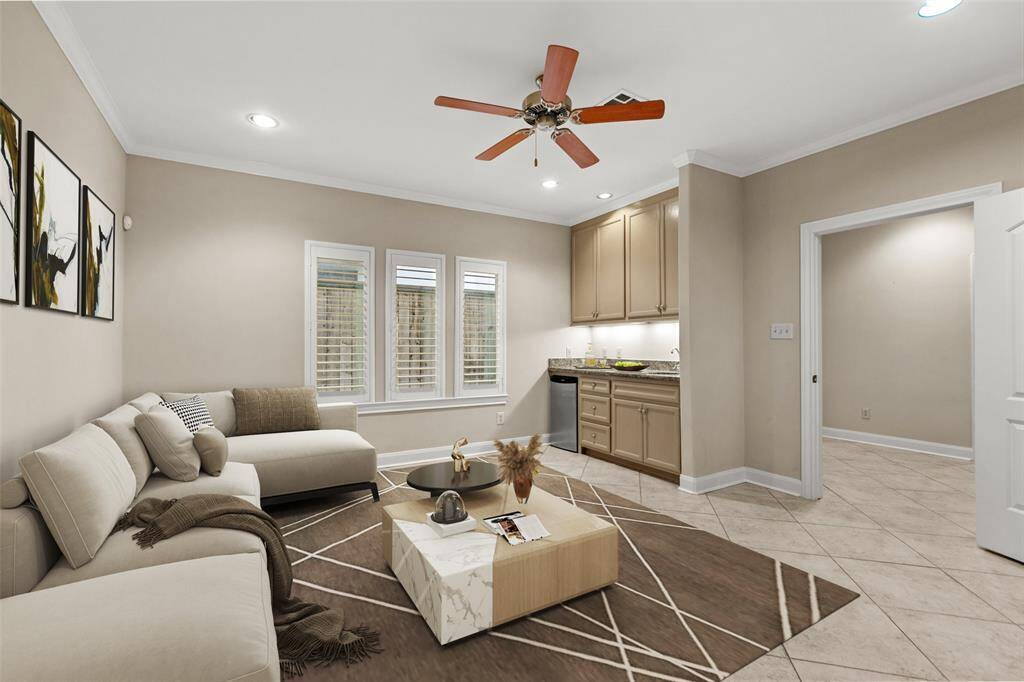 The first floor den and wet bar have been virtually staged.