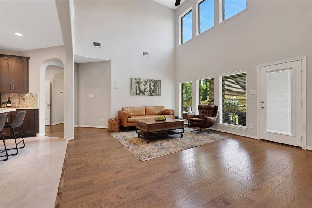 Two levels of windows for lots of natural light and door leading to the covered back patio.