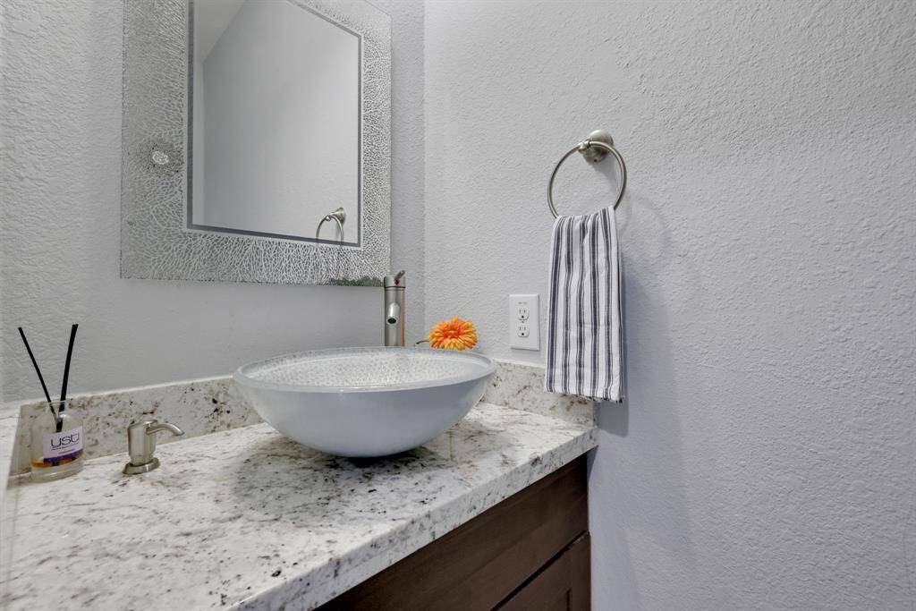 Half bath located just off the kitchen and living area