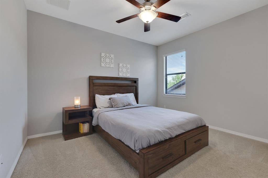 2nd bedroom located at the top of the stairs with its own dedicated full bathroom.